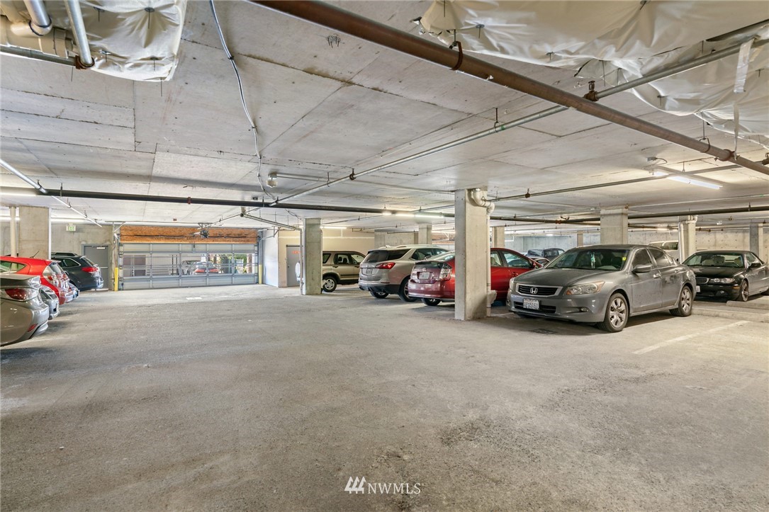 2522 Rucker Avenue, Unit 407 Everett, WA 98201 - Photo 28 of 30 a view of cars parked in a parking