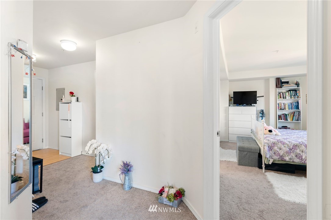 2522 Rucker Avenue, Unit 407 Everett, WA 98201 - Photo 5 of 30 a bedroom with furniture and a window