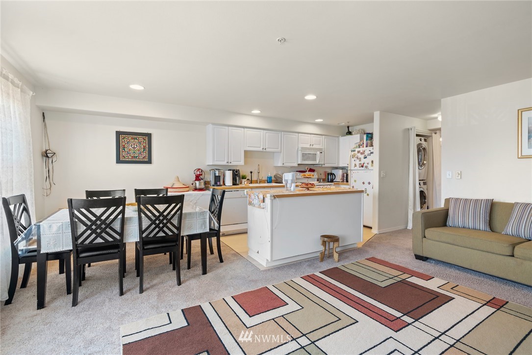 2522 Rucker Avenue, Unit 407 Everett, WA 98201 - Photo 8 of 30 a living room with furniture and kitchen view