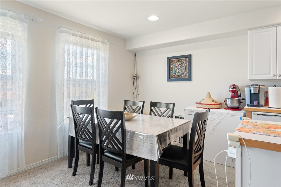 2522 Rucker Avenue, Unit 407 Everett, WA 98201 - Photo 10 of 30 a view of a dining room with furniture