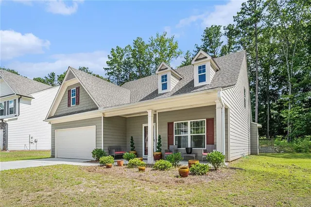 a front view of a house with garden
