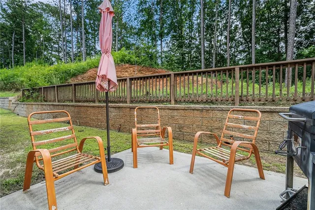 a view of a chairs and table in the balcony
