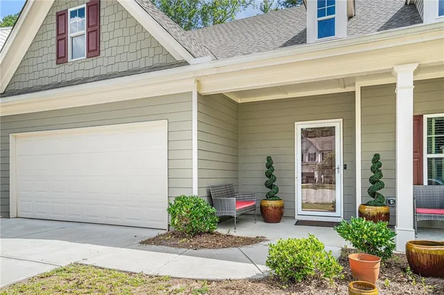a view of a backyard with potted plants