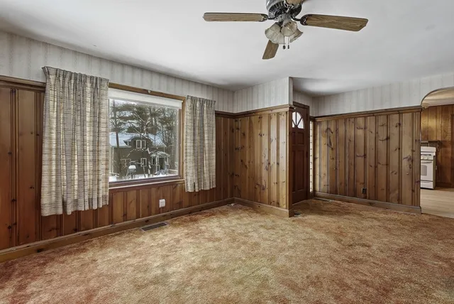 a view of a livingroom with walk in closet and bedroom