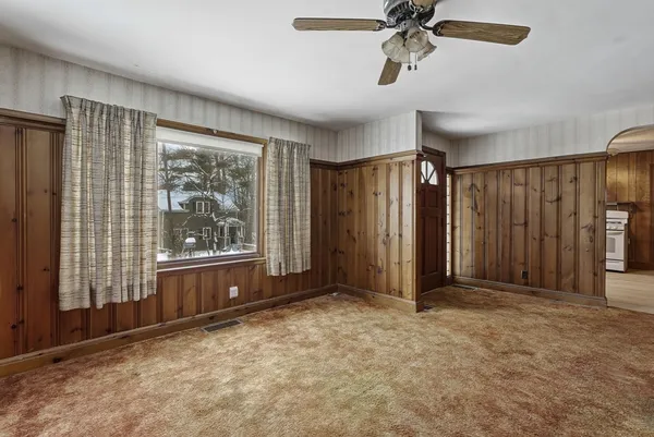 a view of a livingroom with walk in closet and bedroom