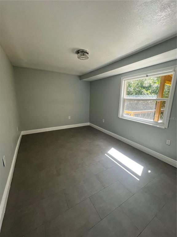 7222 Tropical Drive Weeki Wachee, FL 34607 - Photo 17 of 23 an empty room with a empty space and windows