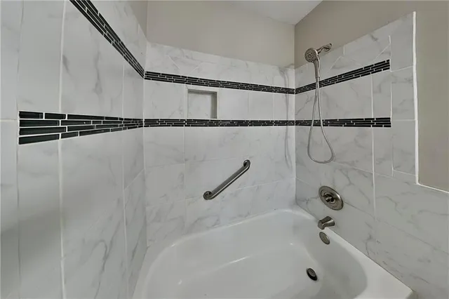 a bathroom with a shower and a bathtub