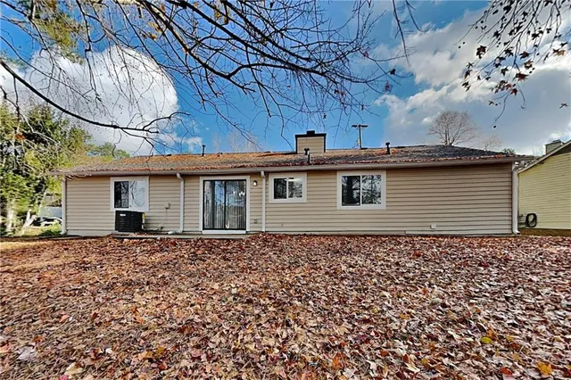 a view of a house with a small yard