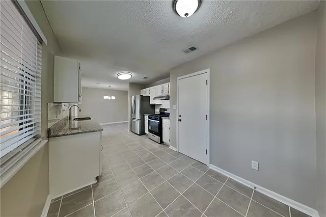 a view of a kitchen with a sink