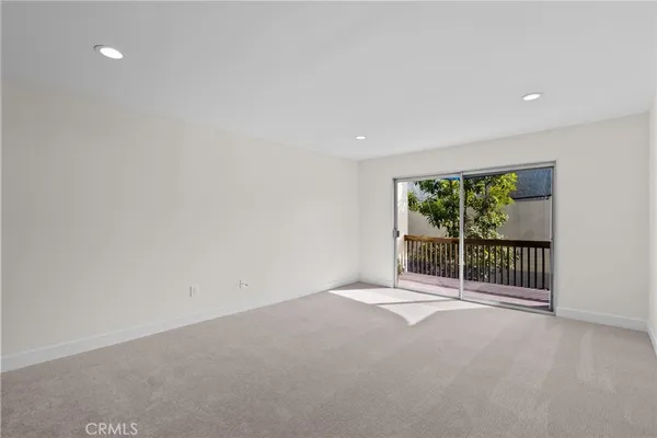 a view of a room with sliding glass door