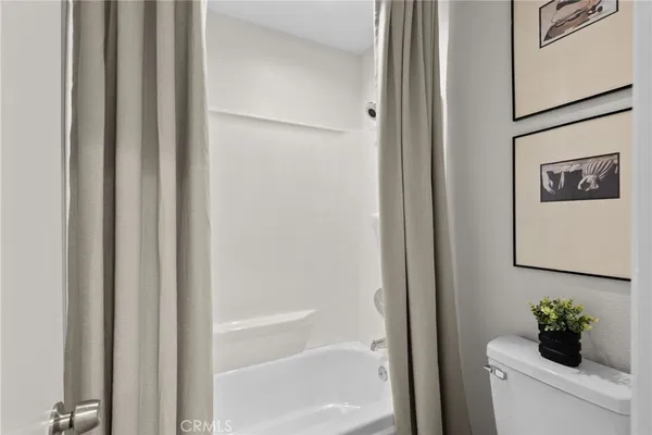 a bath room with a bathtub and a shower