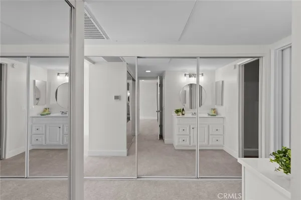 a bathroom with a granite countertop sink mirror and shower