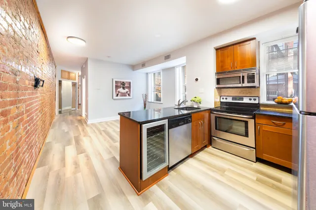 a bathroom with a sink a mirror and a shower