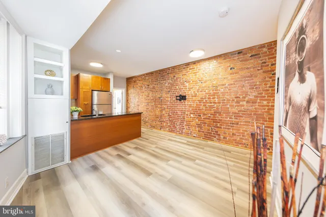 a kitchen with a cabinets and white appliances