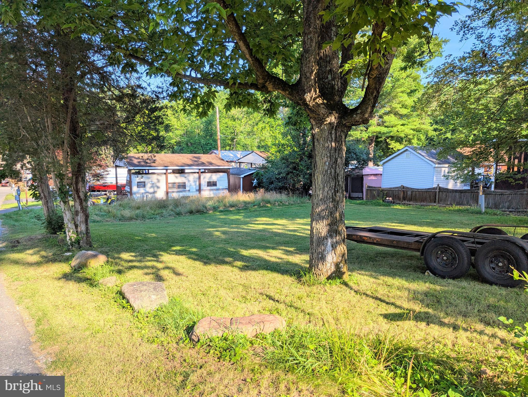 a backyard of a house with lots of green space