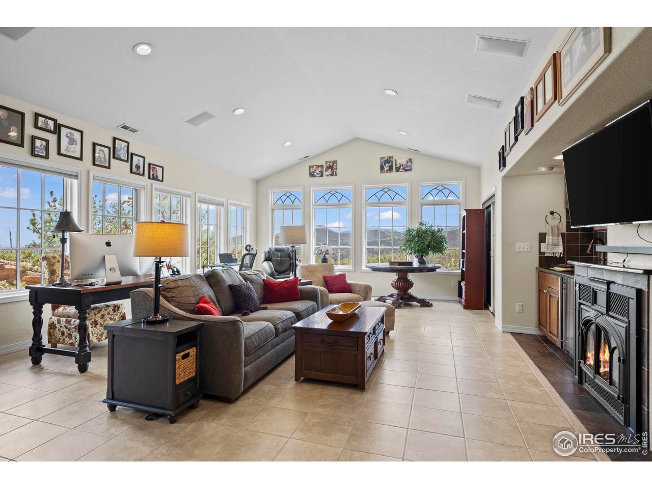 603 Indian Lookout Road Lyons, CO 80540 - Photo 14 of 39 a living room with furniture and a flat screen tv