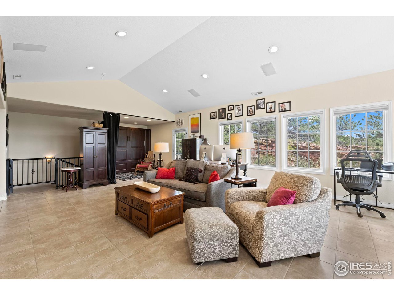 603 Indian Lookout Road Lyons, CO 80540 - Photo 16 of 39 a living room with furniture and a flat screen tv