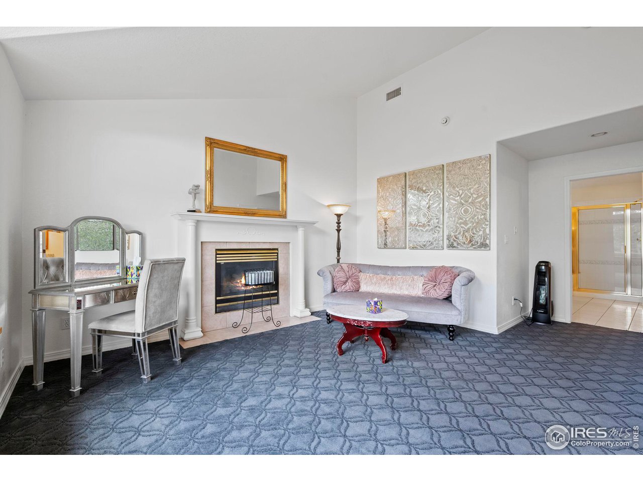603 Indian Lookout Road Lyons, CO 80540 - Photo 22 of 39 a living room with furniture and a fireplace