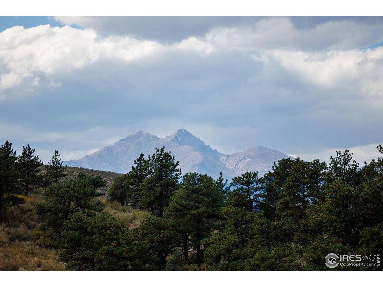 603 Indian Lookout Road Lyons, CO 80540 - Photo 3 of 39 a view of a city and mountain in the back yard