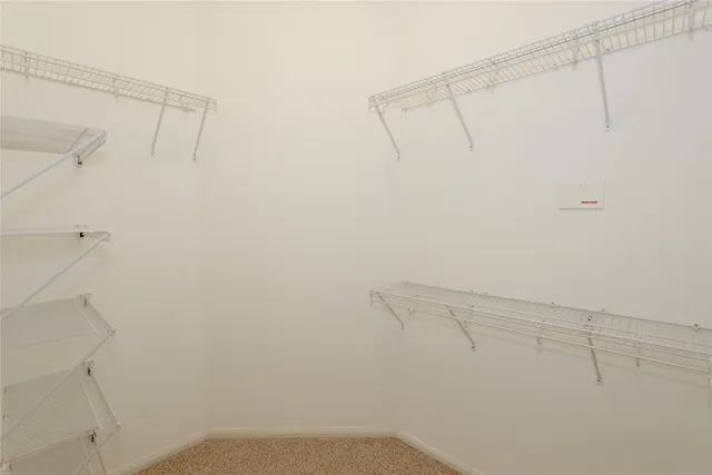 a view of a room with racks on the wall