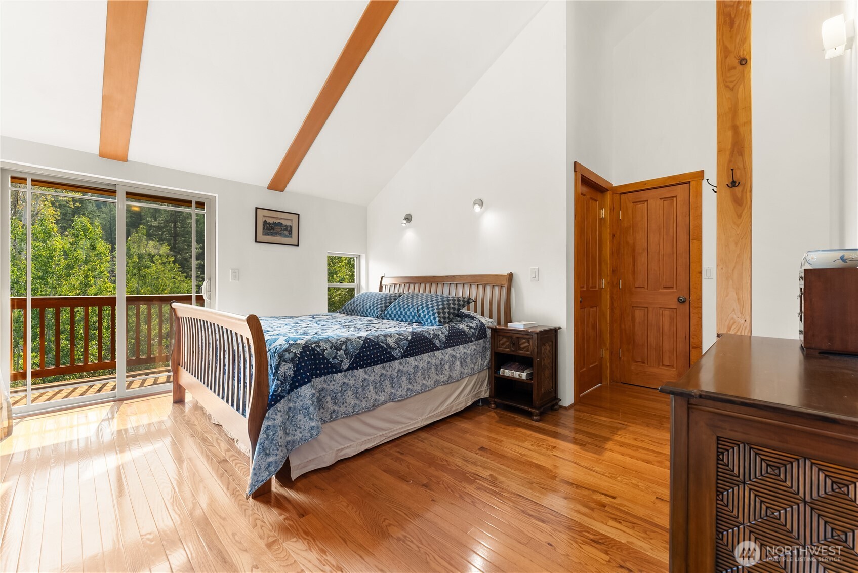 96 Alder Creek Road Twisp, WA 98856 - Photo 21 of 40 a bedroom with a bed and a dresser next to a window