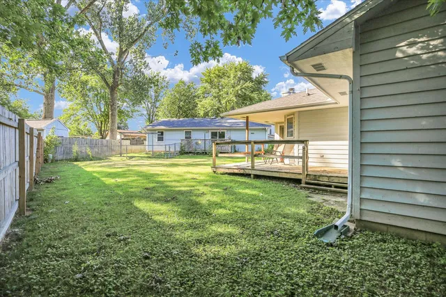 a view of a house with a yard porch and sitting area