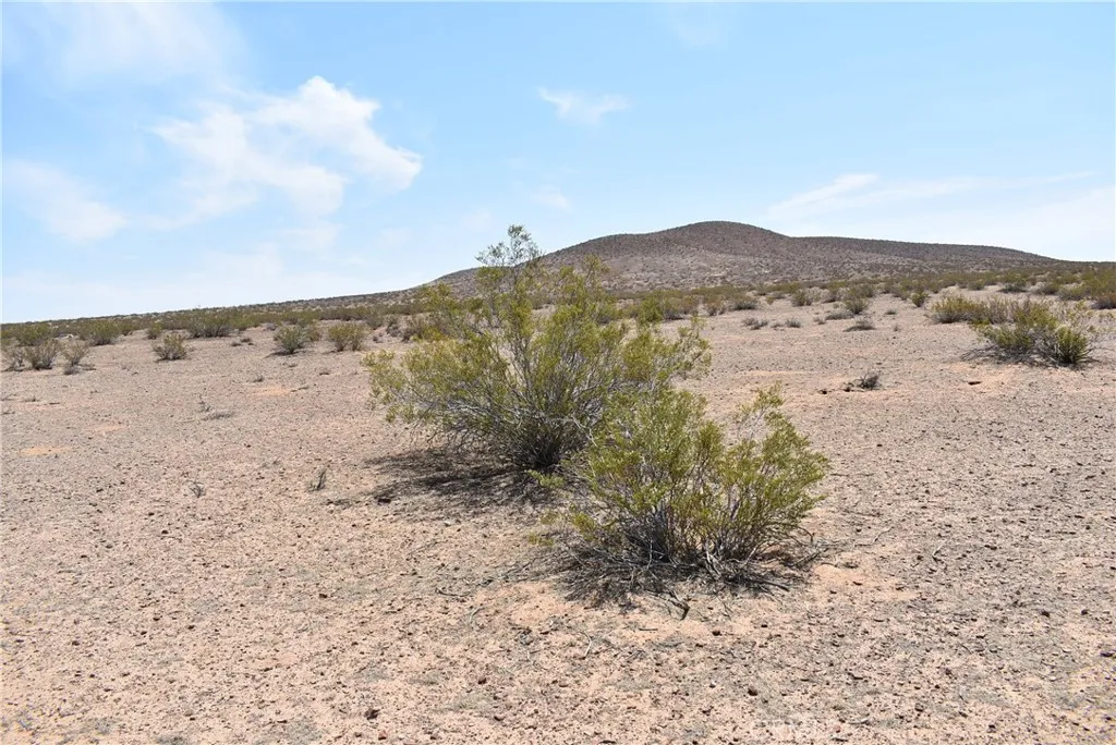 16000 S/o Joshua North Edwards, CA 93523 - Photo 2 of 9 a view of a dry field with mountains in the background