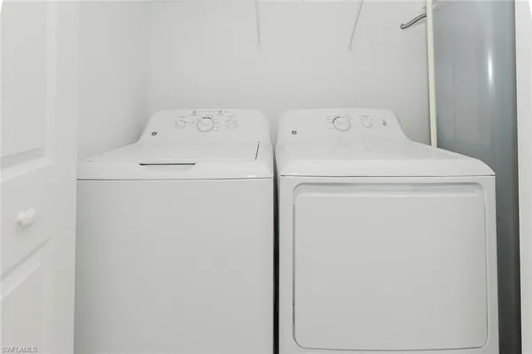 a front view of a house with a yard and porch