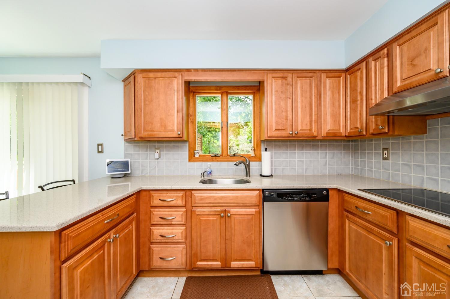 40 Fairfield Road Princeton, NJ 08540 - Photo 13 of 46 a kitchen with stainless steel appliances granite countertop a sink stove and cabinets