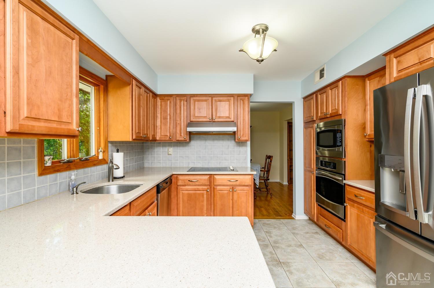 40 Fairfield Road Princeton, NJ 08540 - Photo 15 of 46 a kitchen with stainless steel appliances granite countertop a refrigerator a sink and dishwasher