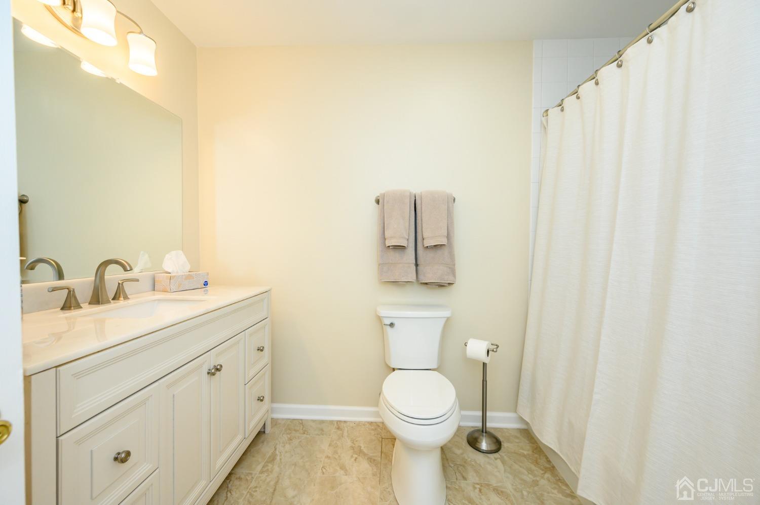 40 Fairfield Road Princeton, NJ 08540 - Photo 23 of 46 a bathroom with a toilet a sink and a mirror