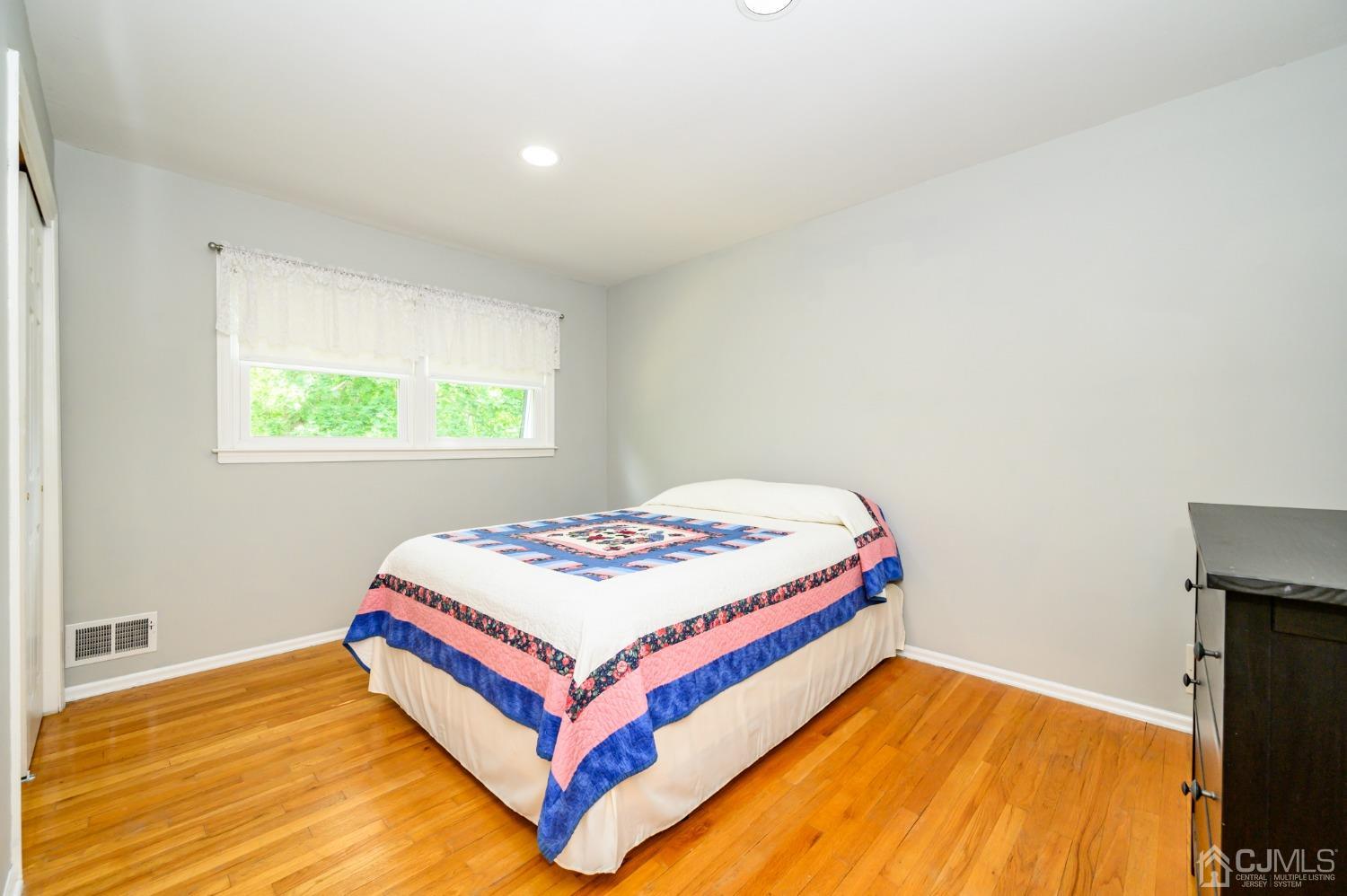 40 Fairfield Road Princeton, NJ 08540 - Photo 31 of 46 a bedroom with a bed and a flat screen tv