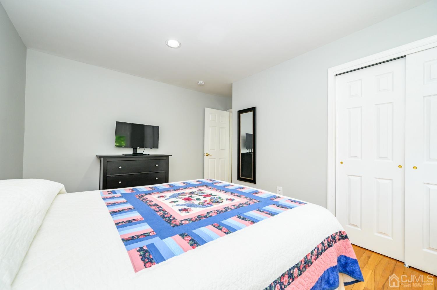 40 Fairfield Road Princeton, NJ 08540 - Photo 33 of 46 a bedroom with a bed and a flat screen tv