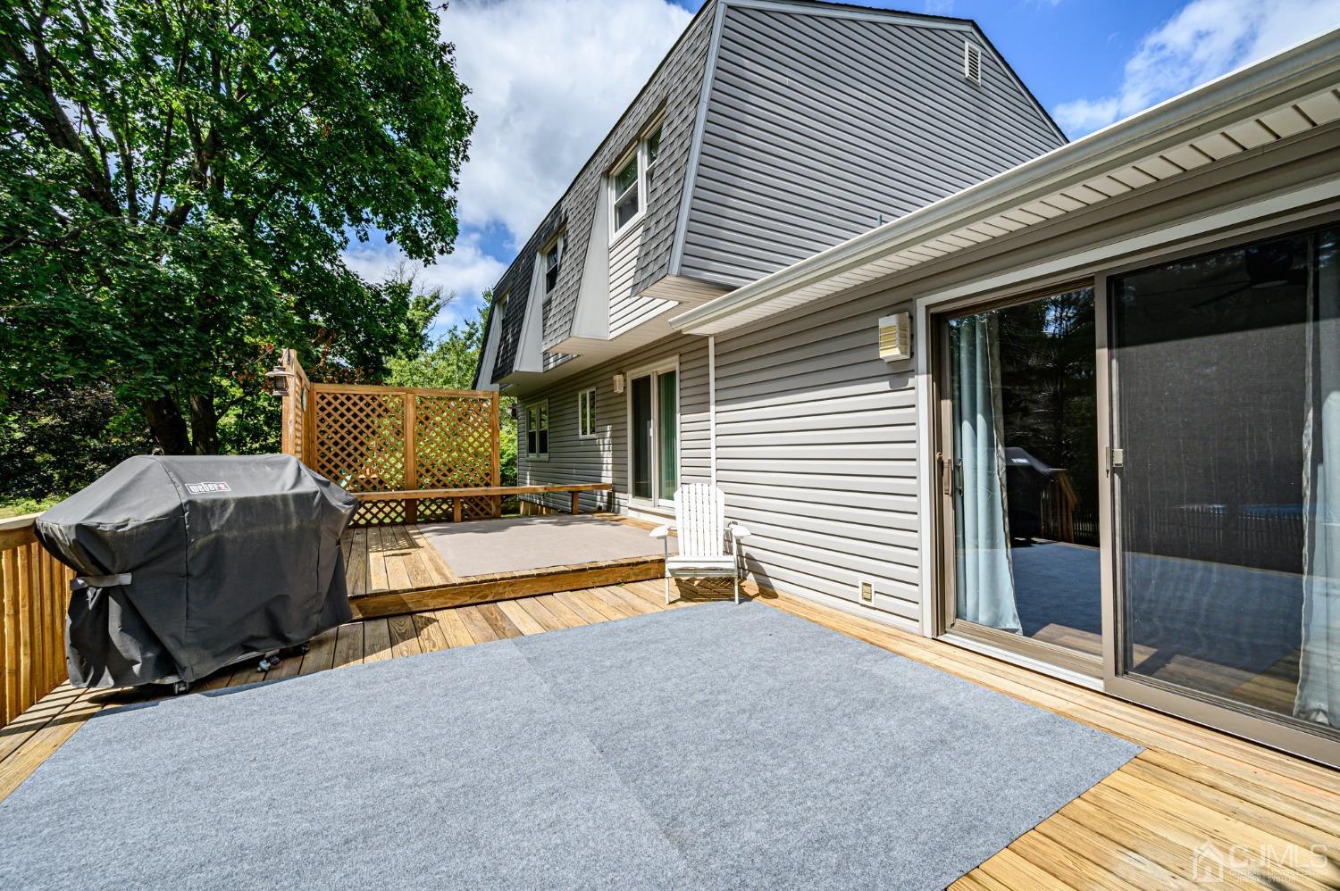40 Fairfield Road Princeton, NJ 08540 - Photo 39 of 46 a view of a patio with table and chairs and floor to ceiling window