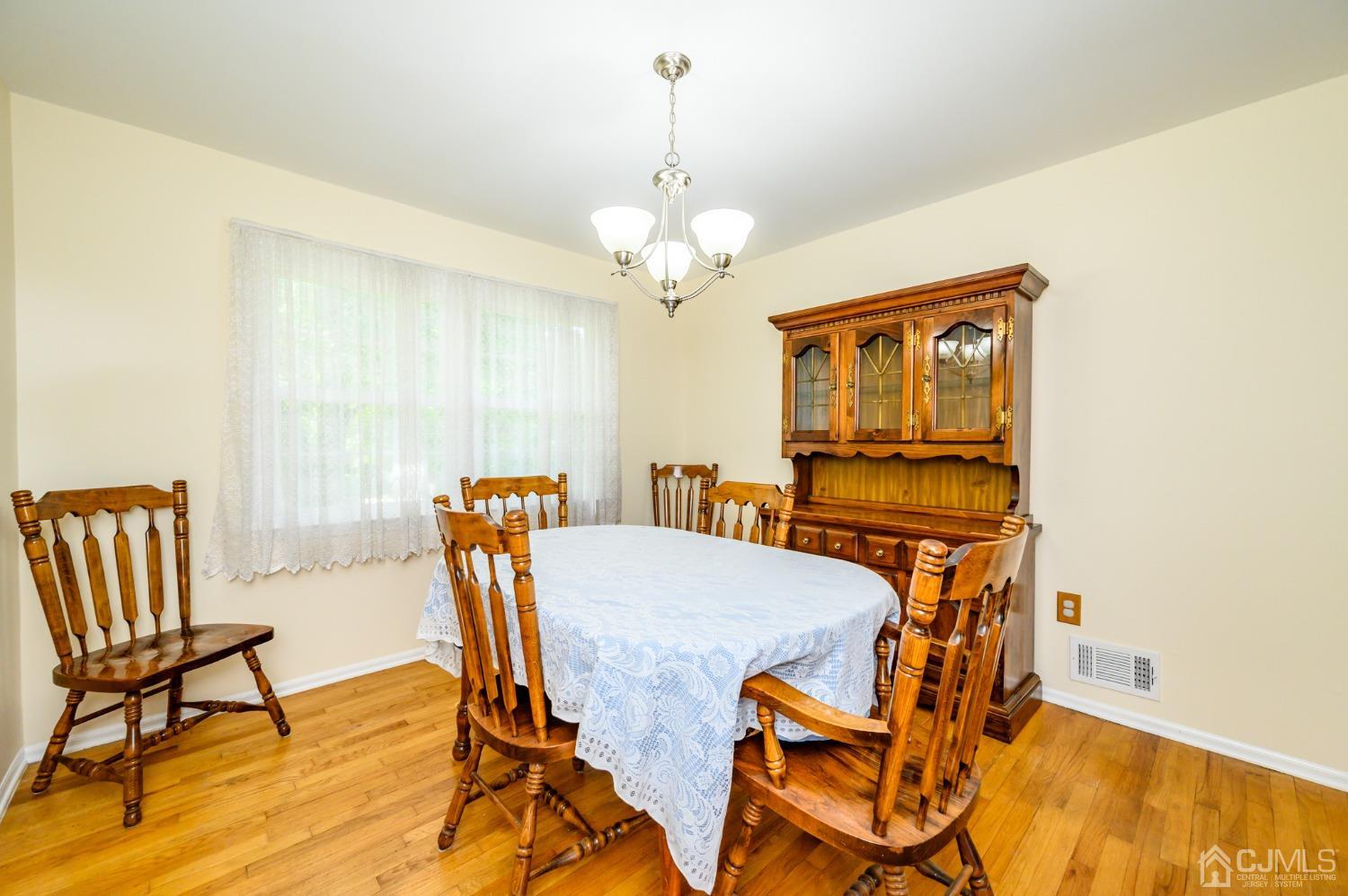 40 Fairfield Road Princeton, NJ 08540 - Photo 8 of 46 a view of a dining room with furniture and a chandelier