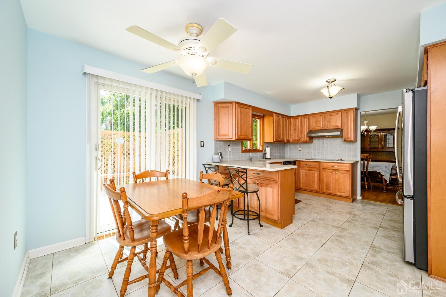 40 Fairfield Road Princeton, NJ 08540 - Photo 10 of 46 a kitchen with stainless steel appliances a table and chairs