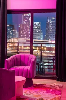 a view of a patio with couches table and chairs and potted plants