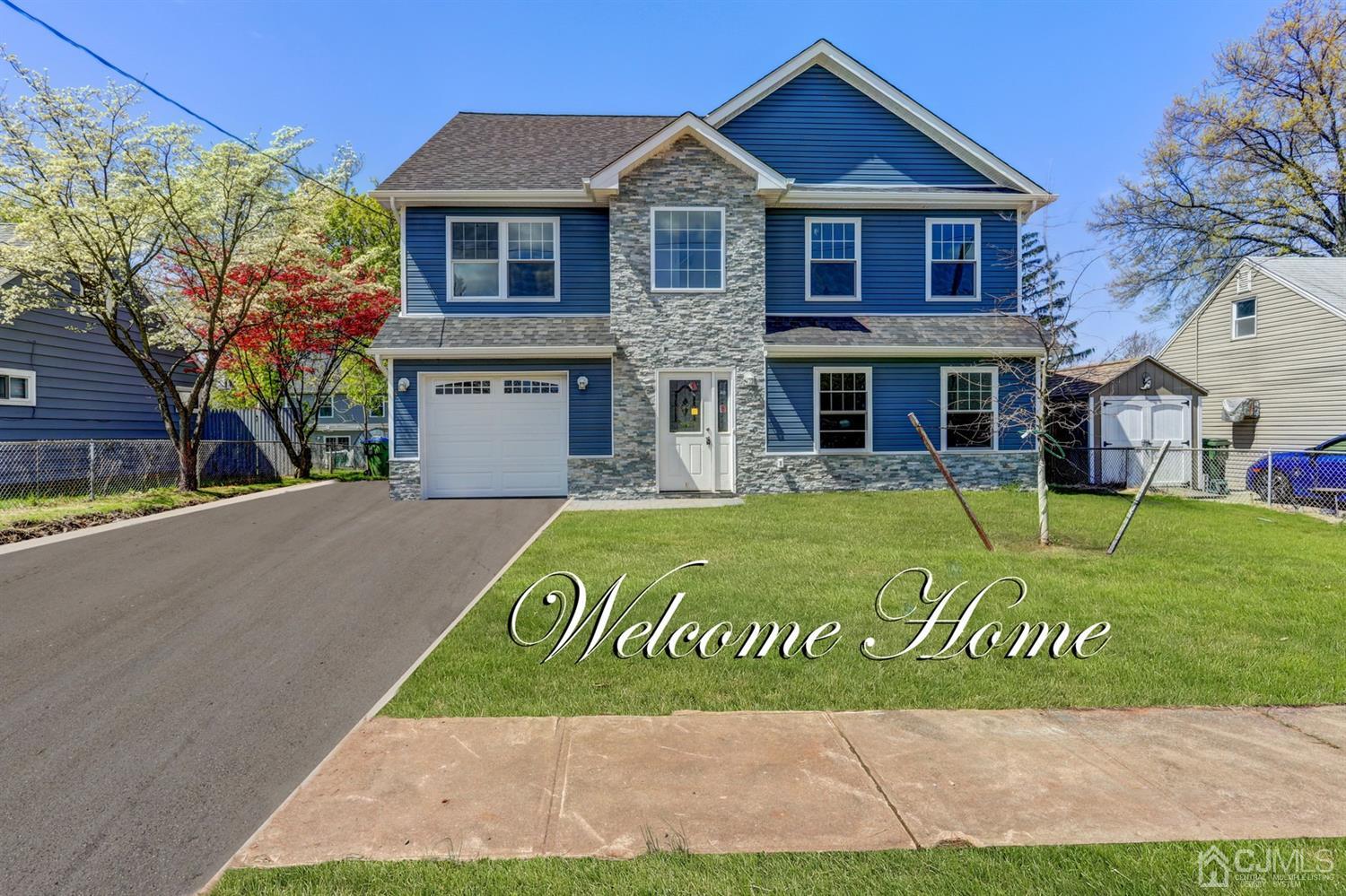 14 Richmond Road Edison, NJ 08817 - Photo 1 of 17 a view of a house with a yard