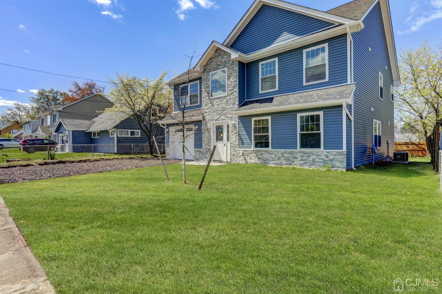 14 Richmond Road Edison, NJ 08817 - Photo 2 of 17 a house view with a garden space