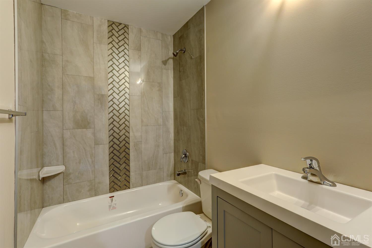 14 Richmond Road Edison, NJ 08817 - Photo 12 of 17 a bathroom with a sink toilet and shower