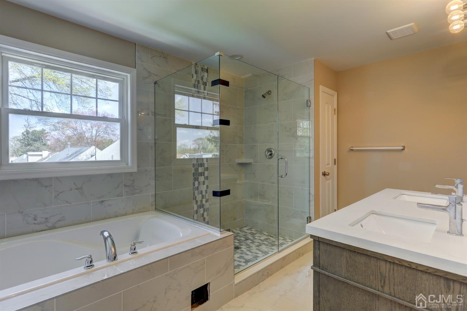 14 Richmond Road Edison, NJ 08817 - Photo 14 of 17 a bathroom with a sink a toilet and shower