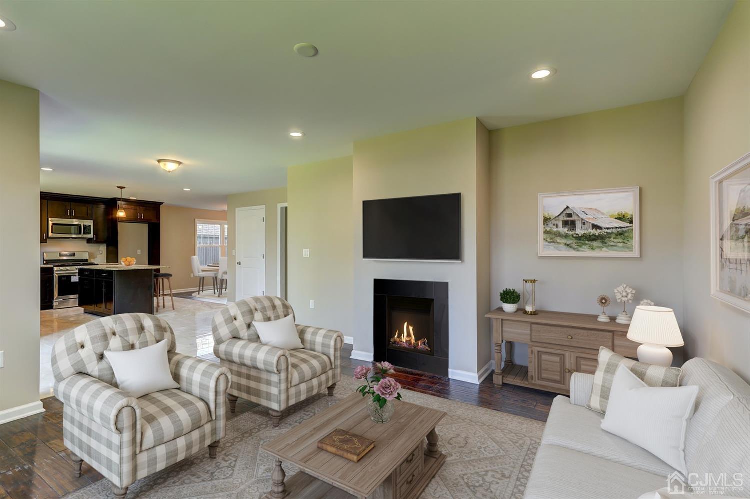 14 Richmond Road Edison, NJ 08817 - Photo 9 of 17 a living room with furniture and a fireplace