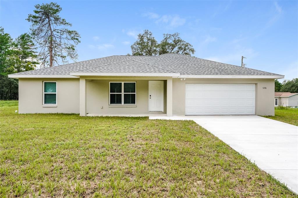5276 Southwest 165th St Road Ocala, FL 34473 - Photo 1 of 1 a front view of house with yard
