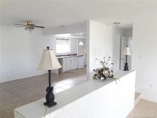 a view of a hallway with a potted plant