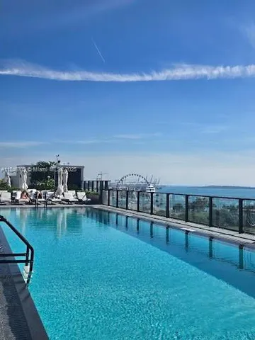 a view of a lake with sitting area