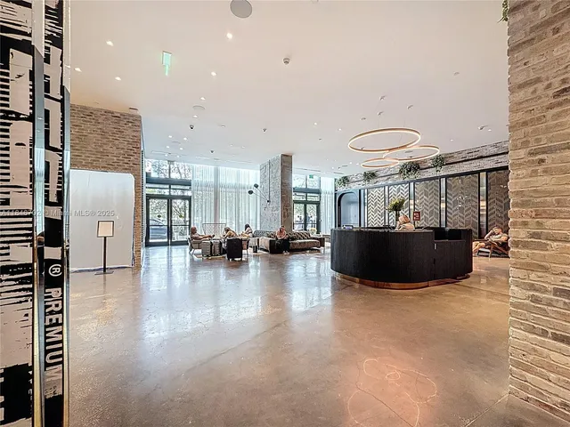 a view of kitchen and hall with wooden floor