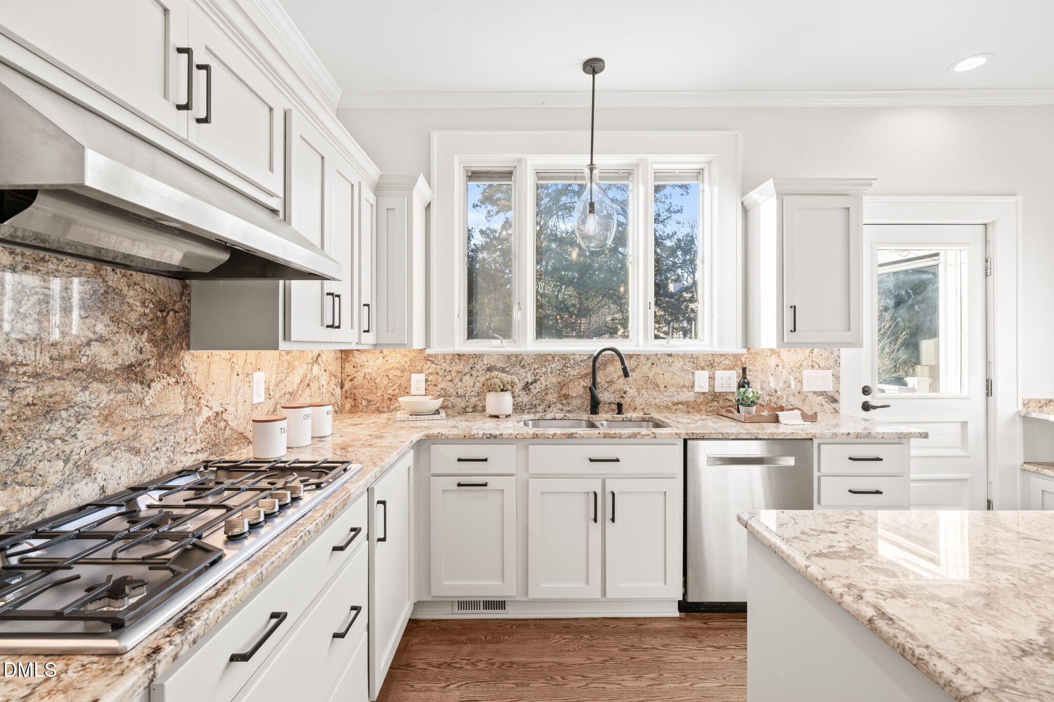1617 Glenwood Avenue Raleigh, NC 27608 - Photo 14 of 58 a kitchen with a sink stove and cabinets