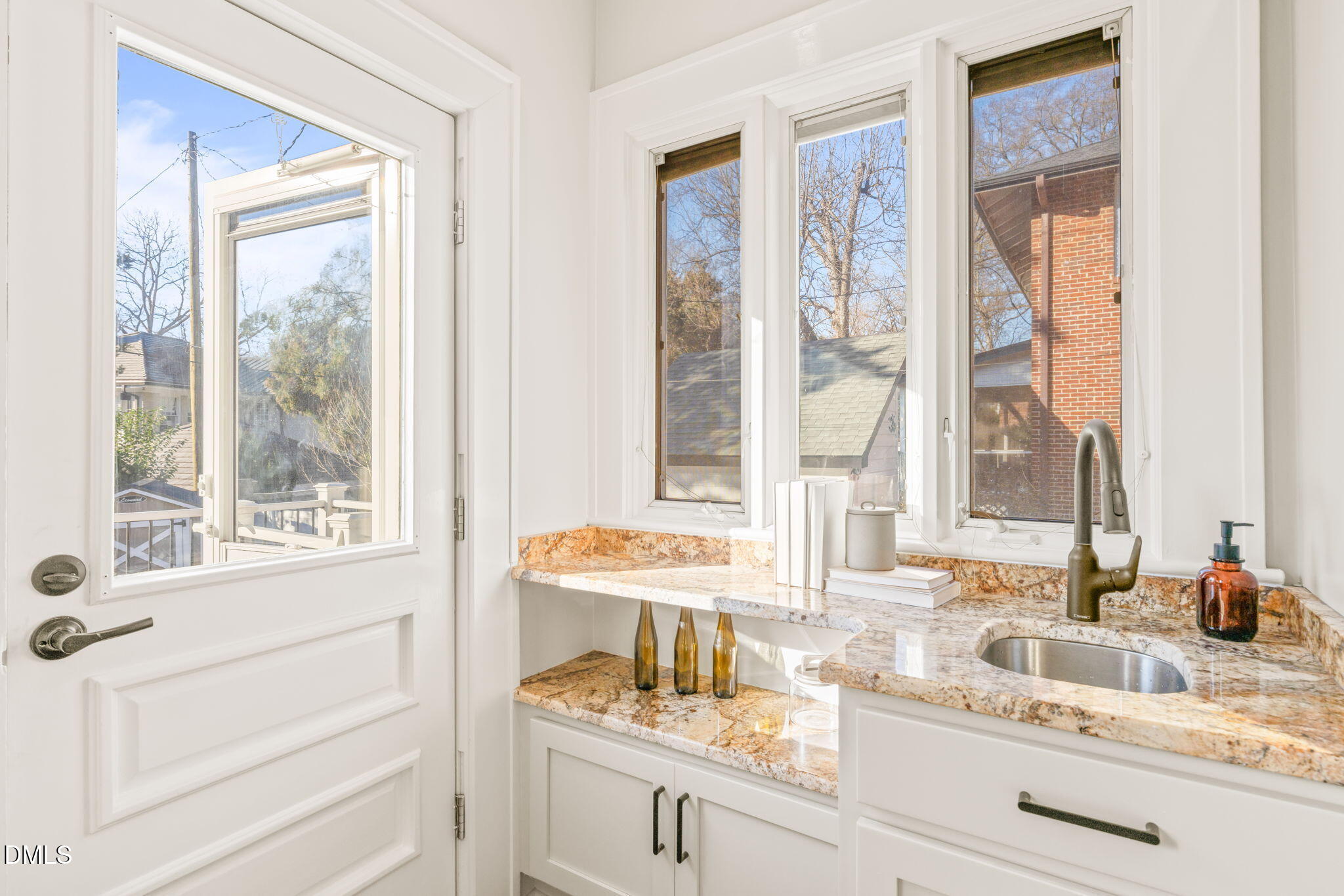 1617 Glenwood Avenue Raleigh, NC 27608 - Photo 17 of 58 a bathroom with a sink and a window