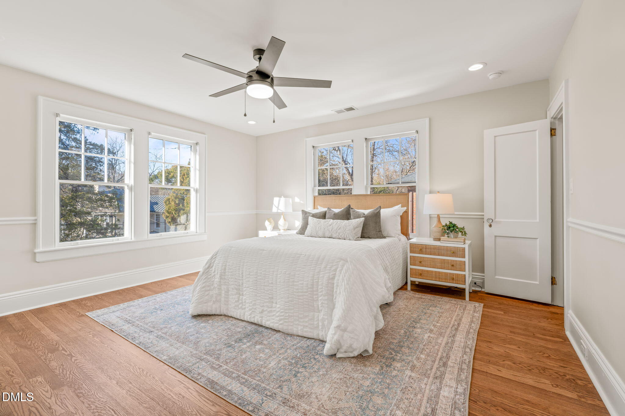1617 Glenwood Avenue Raleigh, NC 27608 - Photo 29 of 58 a bedroom with a bed and a large window