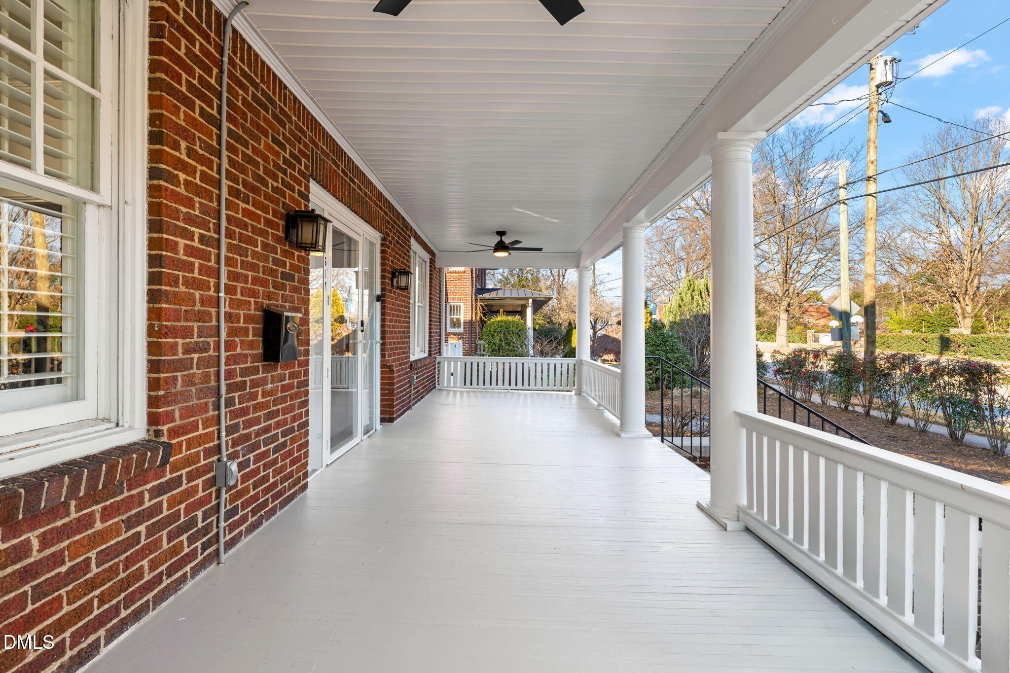 1617 Glenwood Avenue Raleigh, NC 27608 - Photo 48 of 58 a view of a porch with wooden floor and iron stairs
